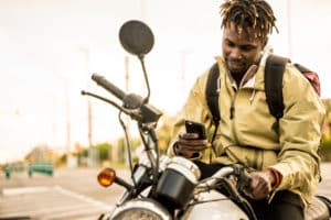 motorcycle rider using social media