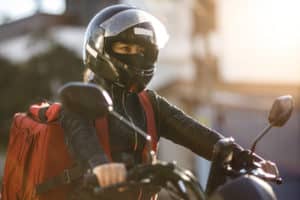 female biker wearing a motorcycle helmet