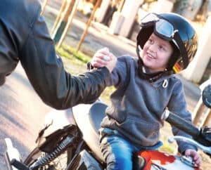 can children ride on motorcycles in Colorado?
