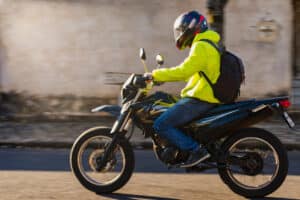 motorcycle rider wearing bright clothes to improve visibility