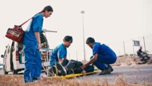 paramedics assisting after a motorcycle accident